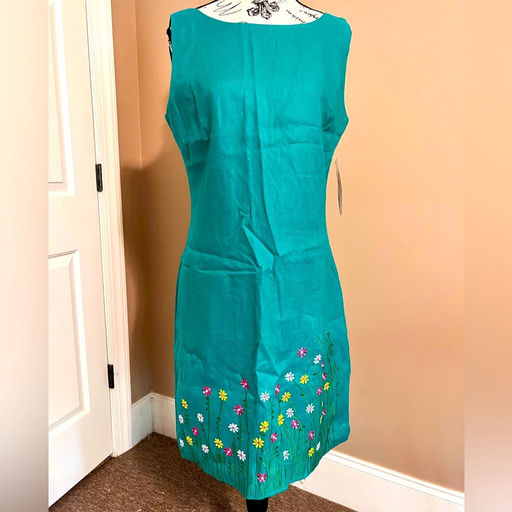 Turquoise dress with flowers around the bottom